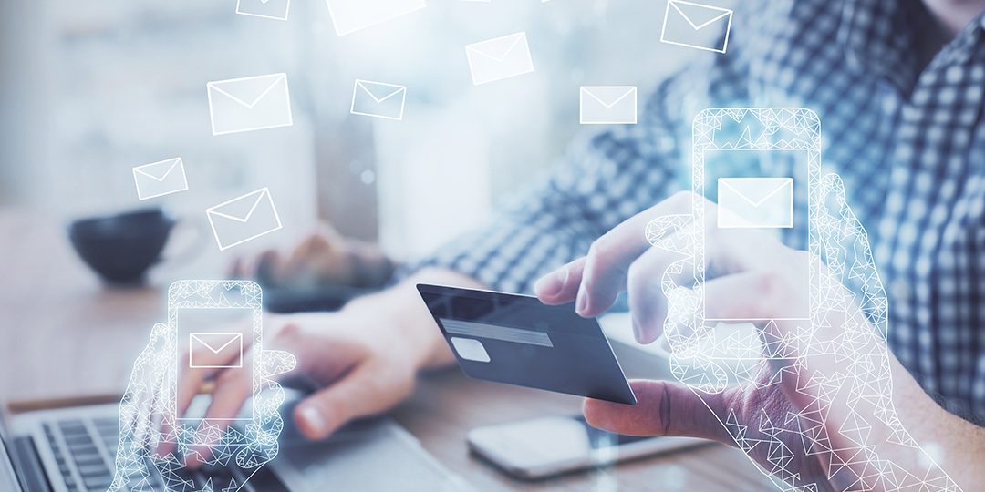 Double exposure of man hands holding a credit card and envelop fly drawing. E-mail and E-commerce pay on-line concept.